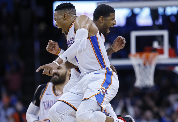 Thunder duo Russell Westbrook and Paul George celebrate during the second half of an NBA game