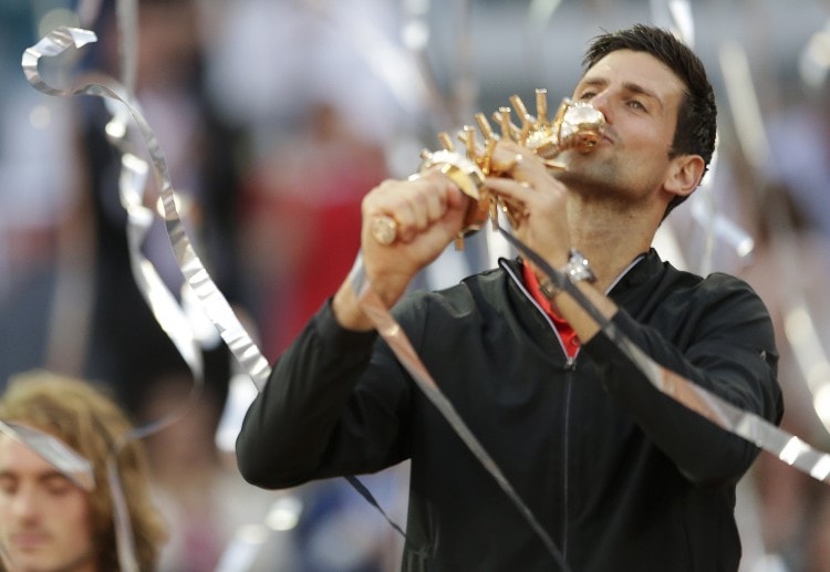 Novak Djokovic celebrates after beating Stefanos Tsitsipas to claim the Madrid Open silverware