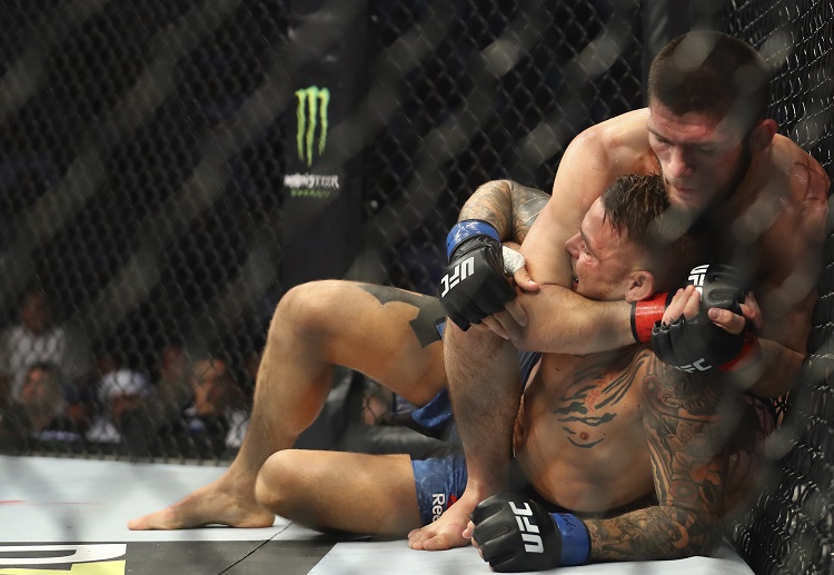 Khabib Nurmagomedov chokes Dustin Poirier during the UFC 242 to win the UFC lightweight title