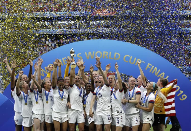 US team celebrate winning the Women's World Cup with the trophy
