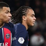 Ethan Mbappe joins his brother, Kylian, on the pitch during PSG's Ligue 1 game against Metz